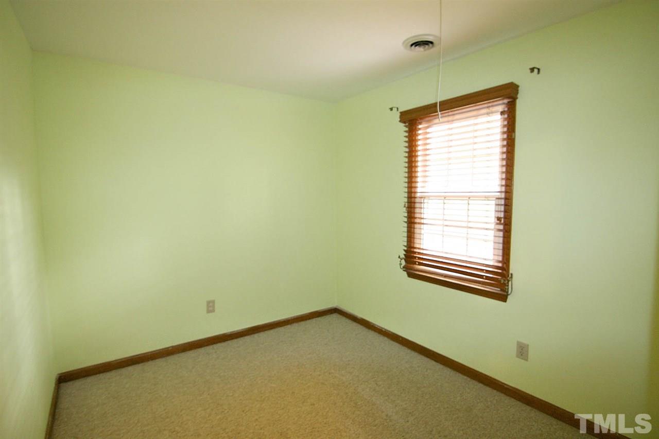 4612 Draper Road Raleigh, NC 27616 - Photo 13 of 16 a view of an empty room with a window