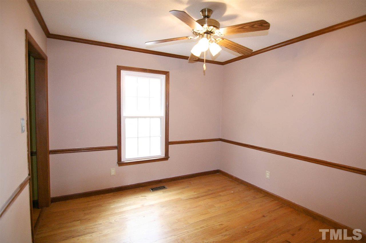 4612 Draper Road Raleigh, NC 27616 - Photo 5 of 16 a view of an empty room with a window