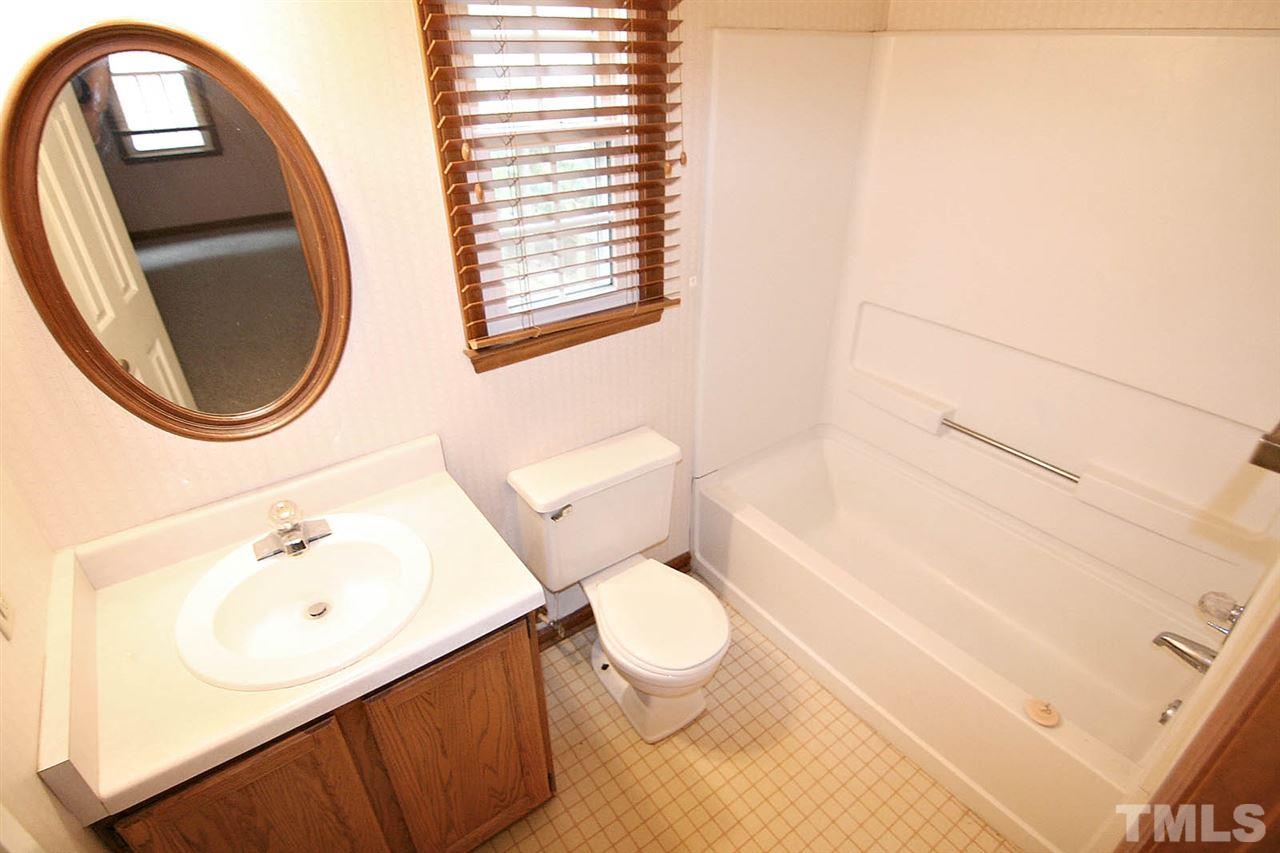 4612 Draper Road Raleigh, NC 27616 - Photo 10 of 16 a bathroom with a sink toilet and a mirror
