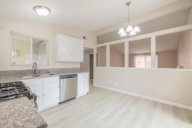 a large kitchen with a stove