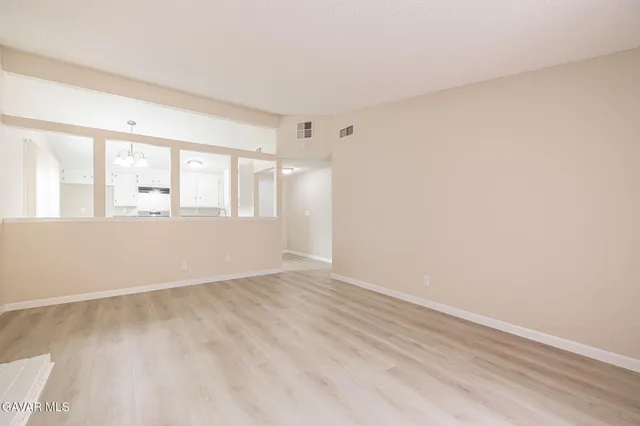 a view of an empty room with a window