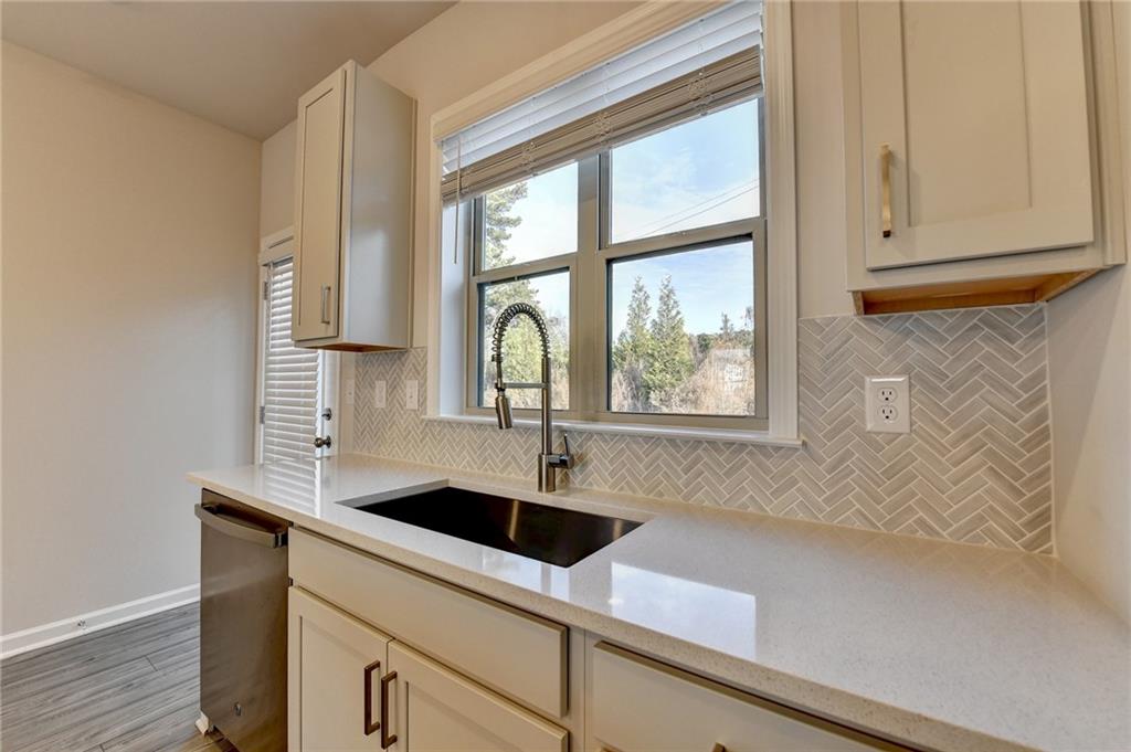 3661 Willingham Run Southwest Marietta, GA 30008 - Photo 12 of 46 a kitchen with a sink and cabinets