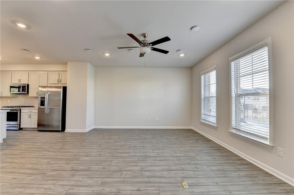 3661 Willingham Run Southwest Marietta, GA 30008 - Photo 15 of 46 a view of a kitchen with furniture and a ceiling fan