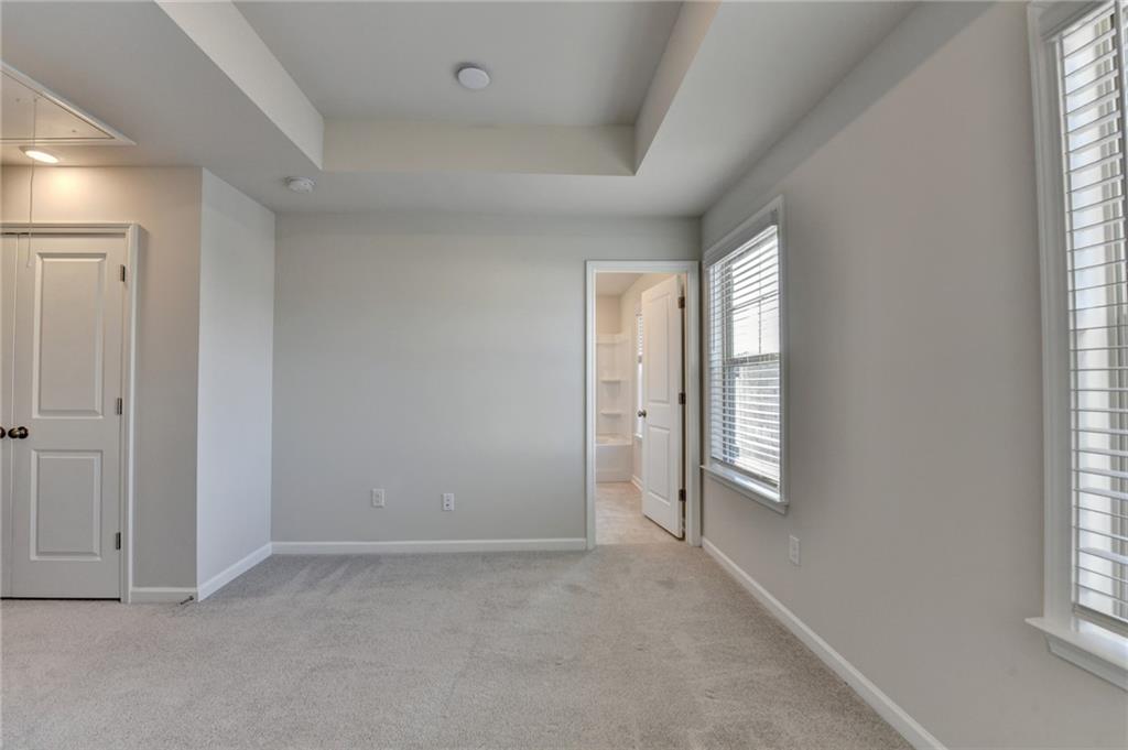3661 Willingham Run Southwest Marietta, GA 30008 - Photo 41 of 46 an empty room with windows and closet