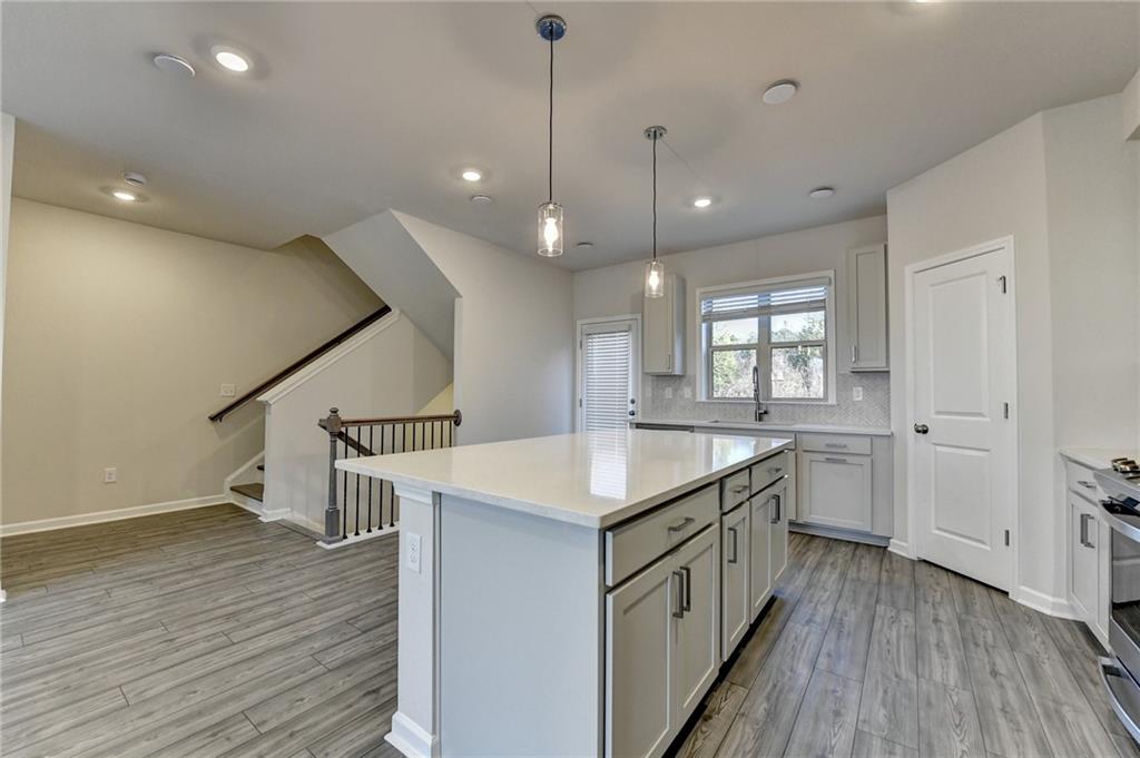 3661 Willingham Run Southwest Marietta, GA 30008 - Photo 10 of 46 a kitchen with a sink and wooden floor