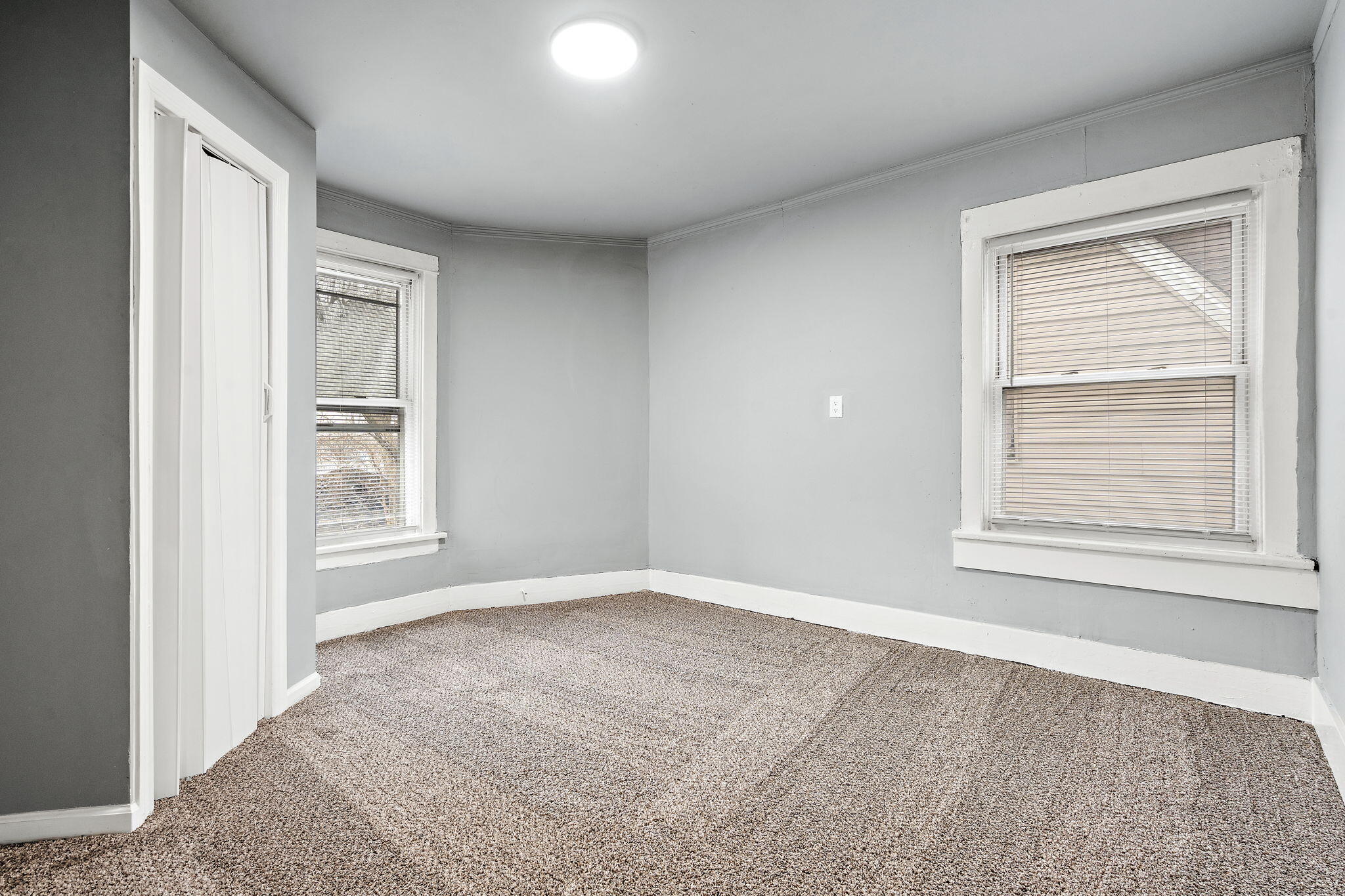 565 Jackson Street Gary, IN 46402 - Photo 16 of 19 a view of an empty room with a window