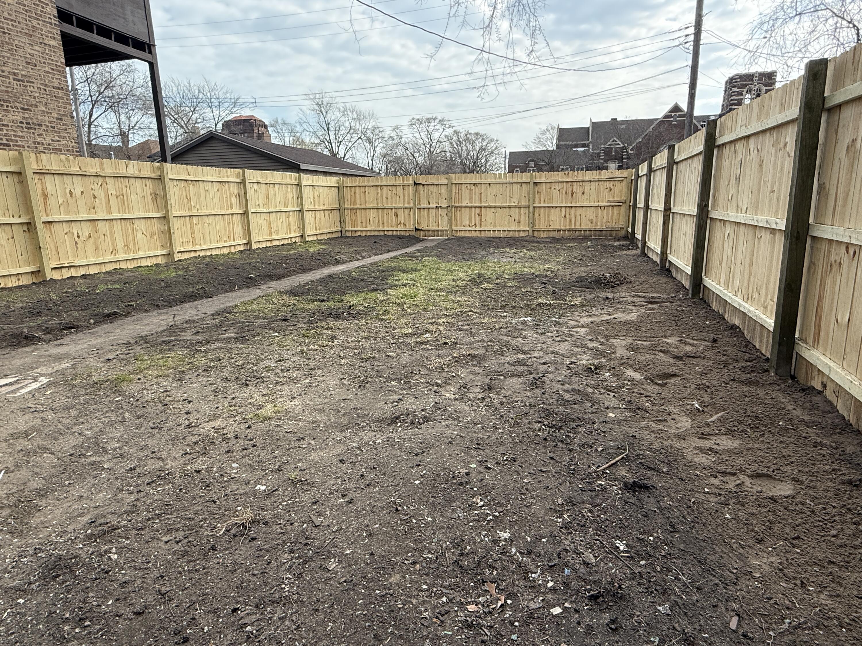 565 Jackson Street Gary, IN 46402 - Photo 2 of 19 a view of a backyard