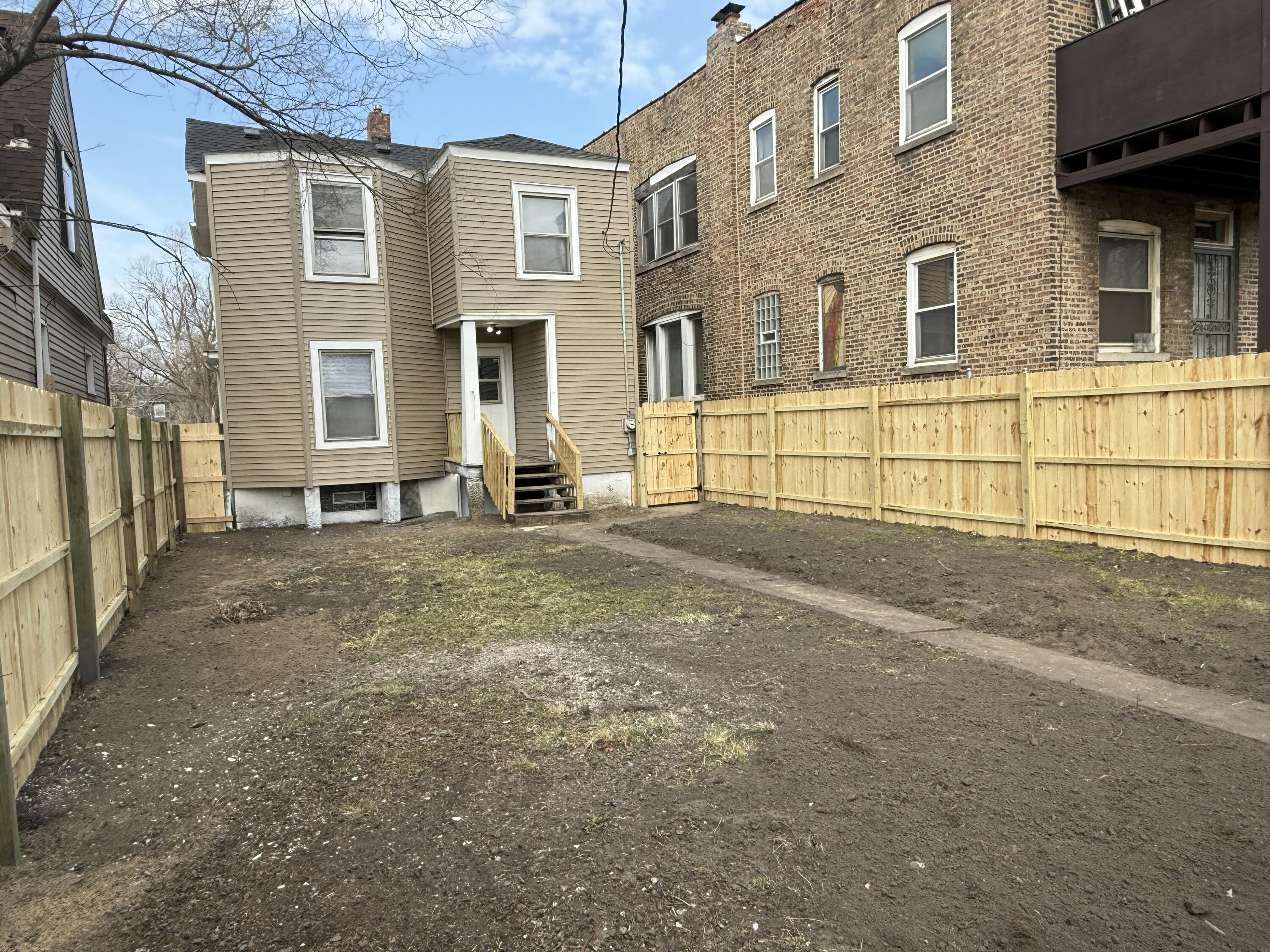 565 Jackson Street Gary, IN 46402 - Photo 3 of 19 a view of a brick house with many windows