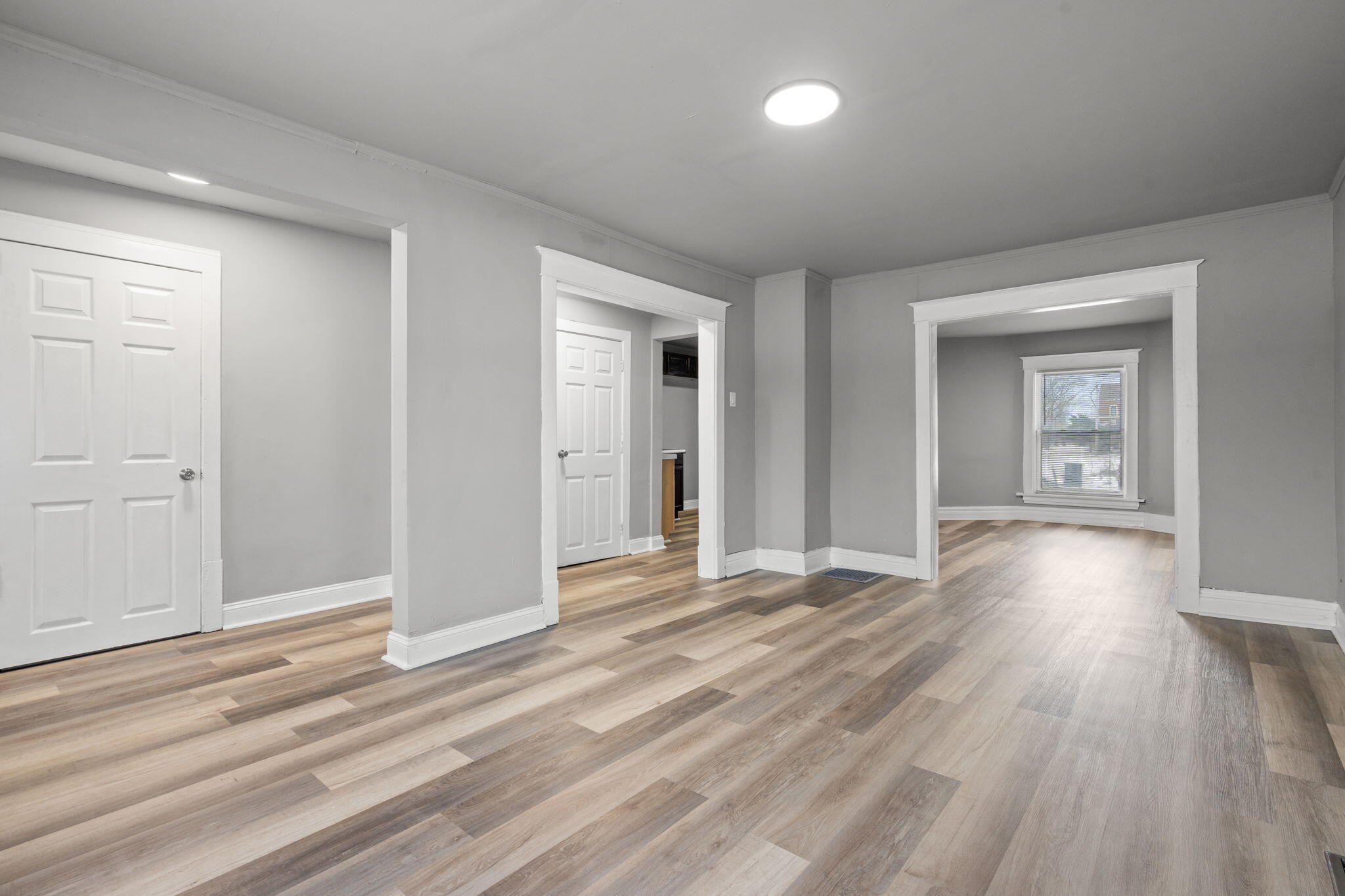 565 Jackson Street Gary, IN 46402 - Photo 5 of 19 an empty room with wooden floor and closet
