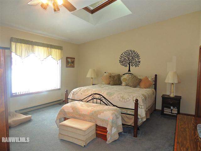 4702 Thorne Road Marengo, IL 60152 - Photo 8 of 12 a bedroom with a bed and a window