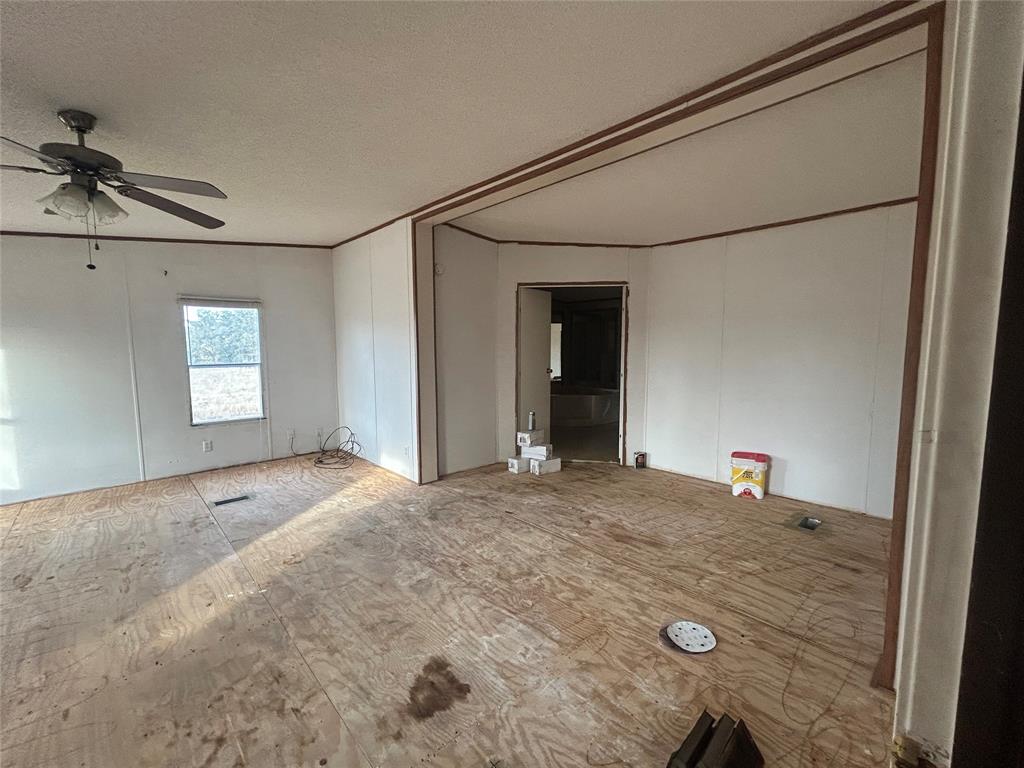 2300 County Road 3525 Dike, TX 75437 - Photo 12 of 14 a view of a bedroom with a sink and cabinets