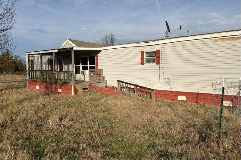 2300 County Road 3525 Dike, TX 75437 - Photo 2 of 14 a view of a house with a yard