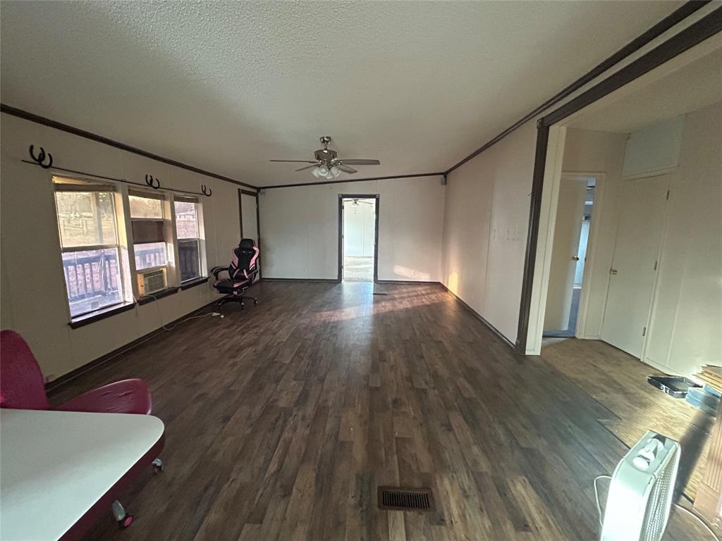 2300 County Road 3525 Dike, TX 75437 - Photo 10 of 14 a view of a livingroom with wooden floor and a window