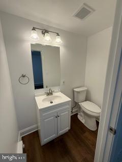 7717 Pearsons Corner Road Dover, DE 19904 - Photo 8 of 17 a bathroom with a toilet sink and mirror