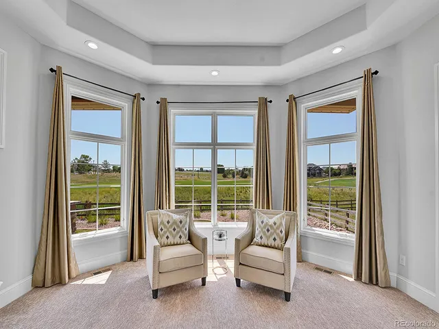 a room with furniture and a large window