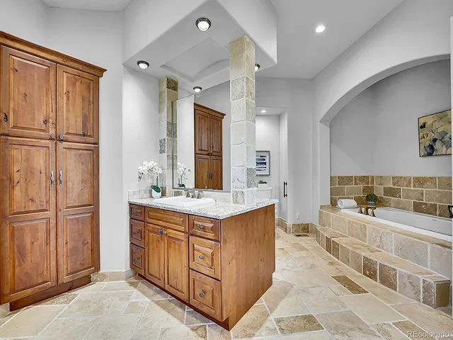 a large kitchen with a stove and refrigerator