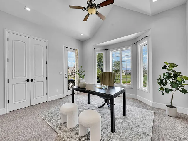 a view of a livingroom with furniture and a potted plant