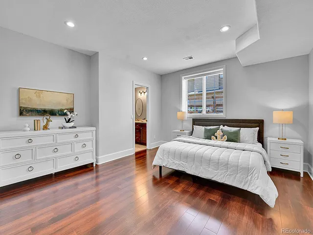 a bedroom with a bed and a dresser