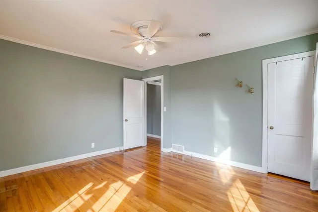 a view of backyard with wooden fence