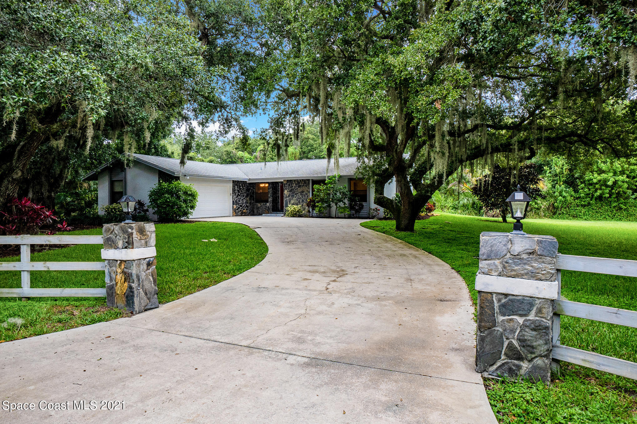 1805 Evers Road Melbourne, FL 32934 - Photo 1 of 29 a view of a house with a yard