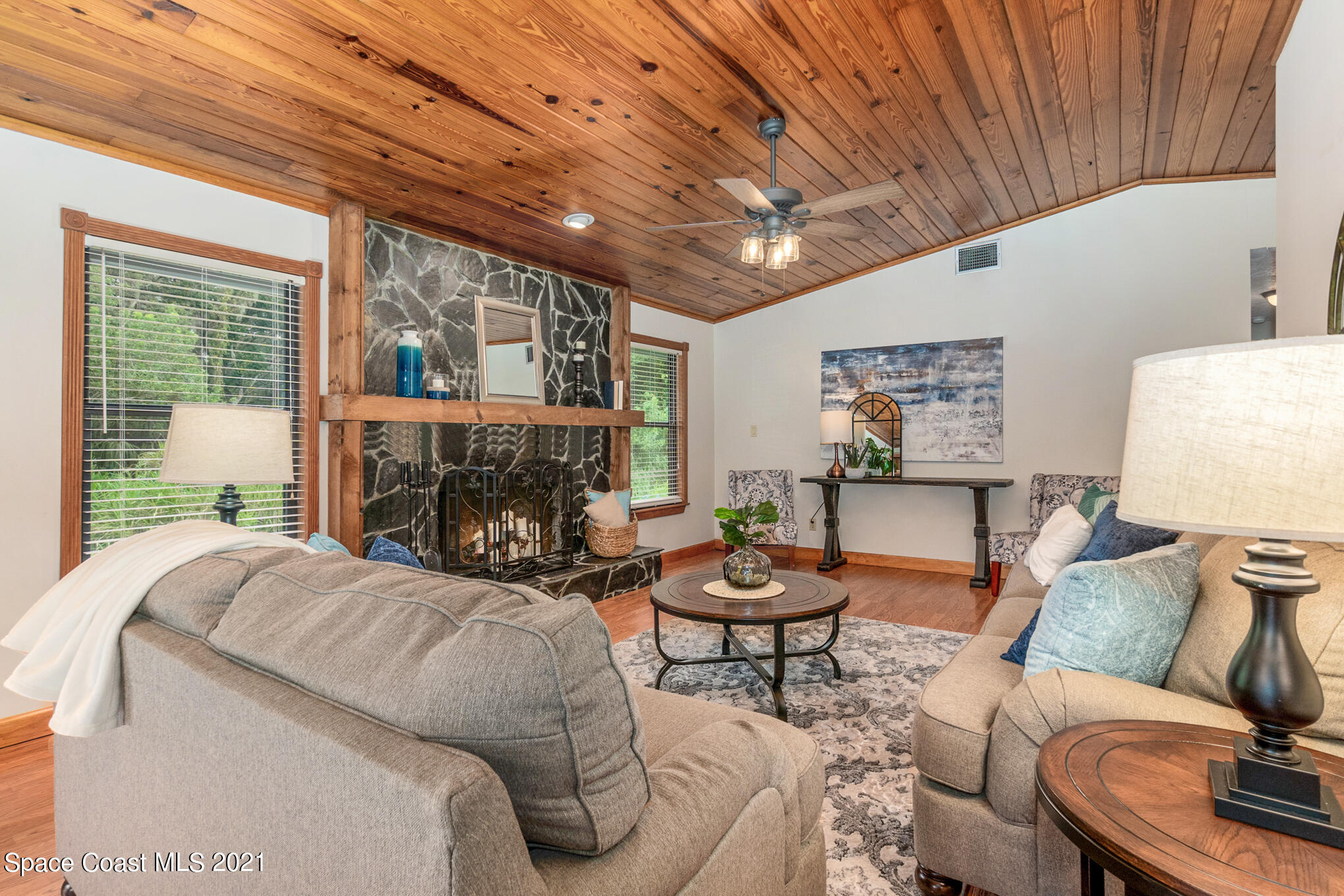 1805 Evers Road Melbourne, FL 32934 - Photo 2 of 29 a living room with furniture and a fireplace