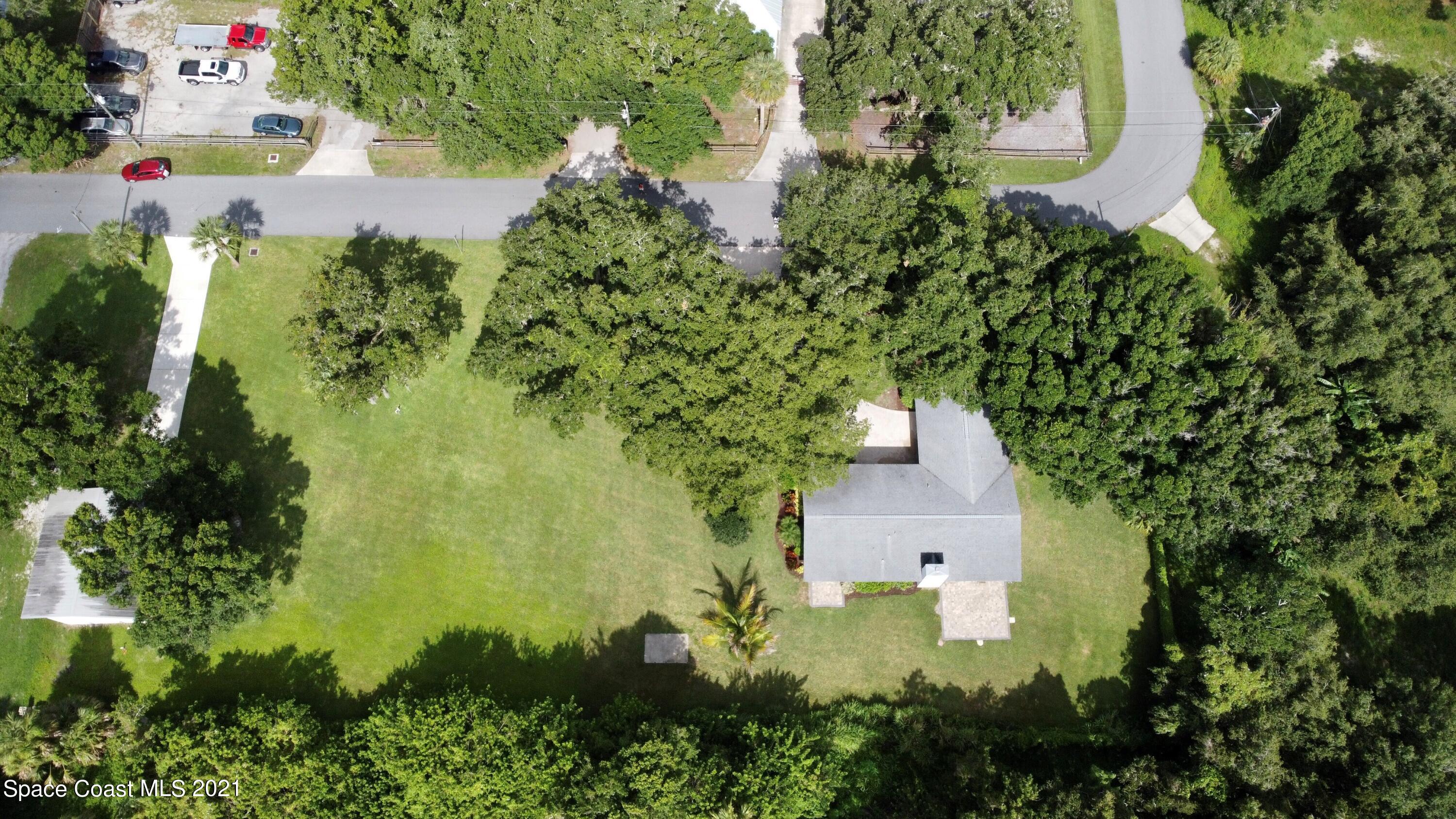 1805 Evers Road Melbourne, FL 32934 - Photo 20 of 29 an aerial view of residential house with outdoor space and trees all around