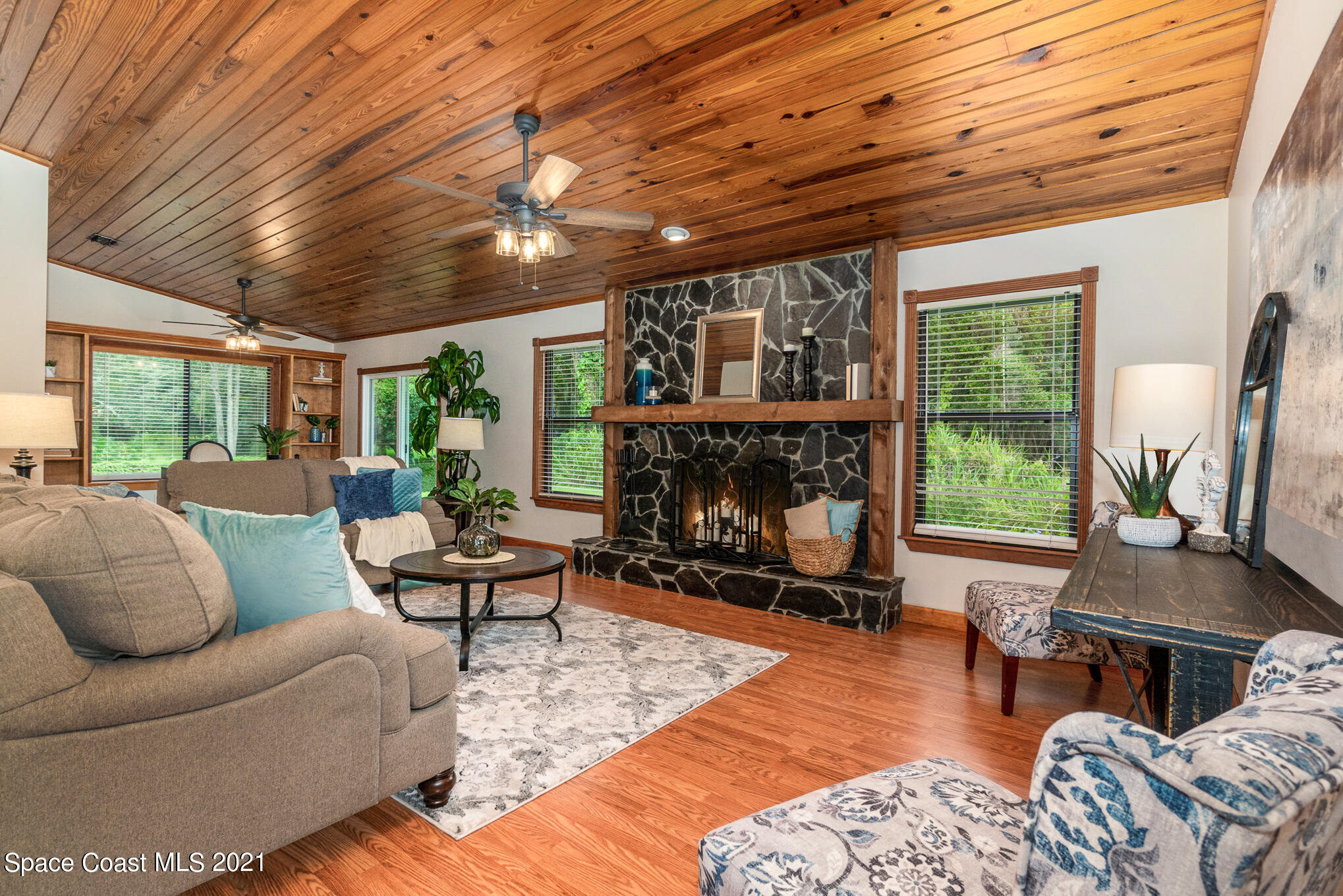 1805 Evers Road Melbourne, FL 32934 - Photo 3 of 29 a living room with furniture and a fireplace
