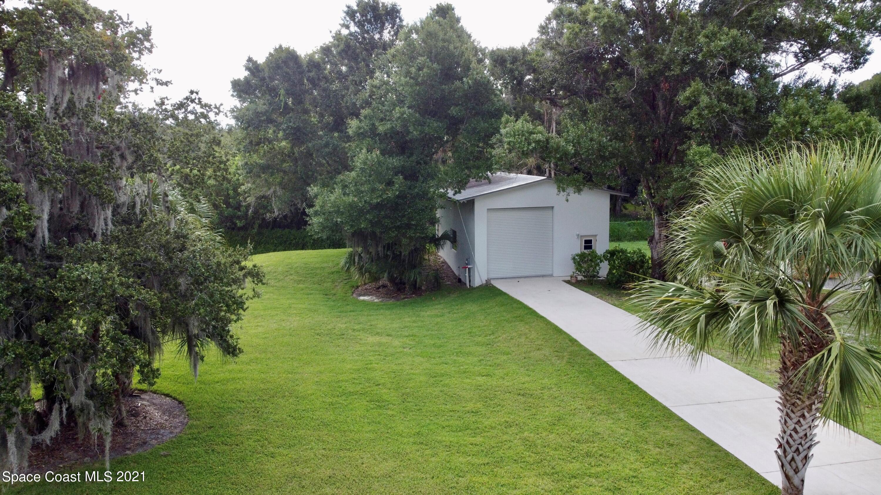 1805 Evers Road Melbourne, FL 32934 - Photo 22 of 29 a front view of a house with garden