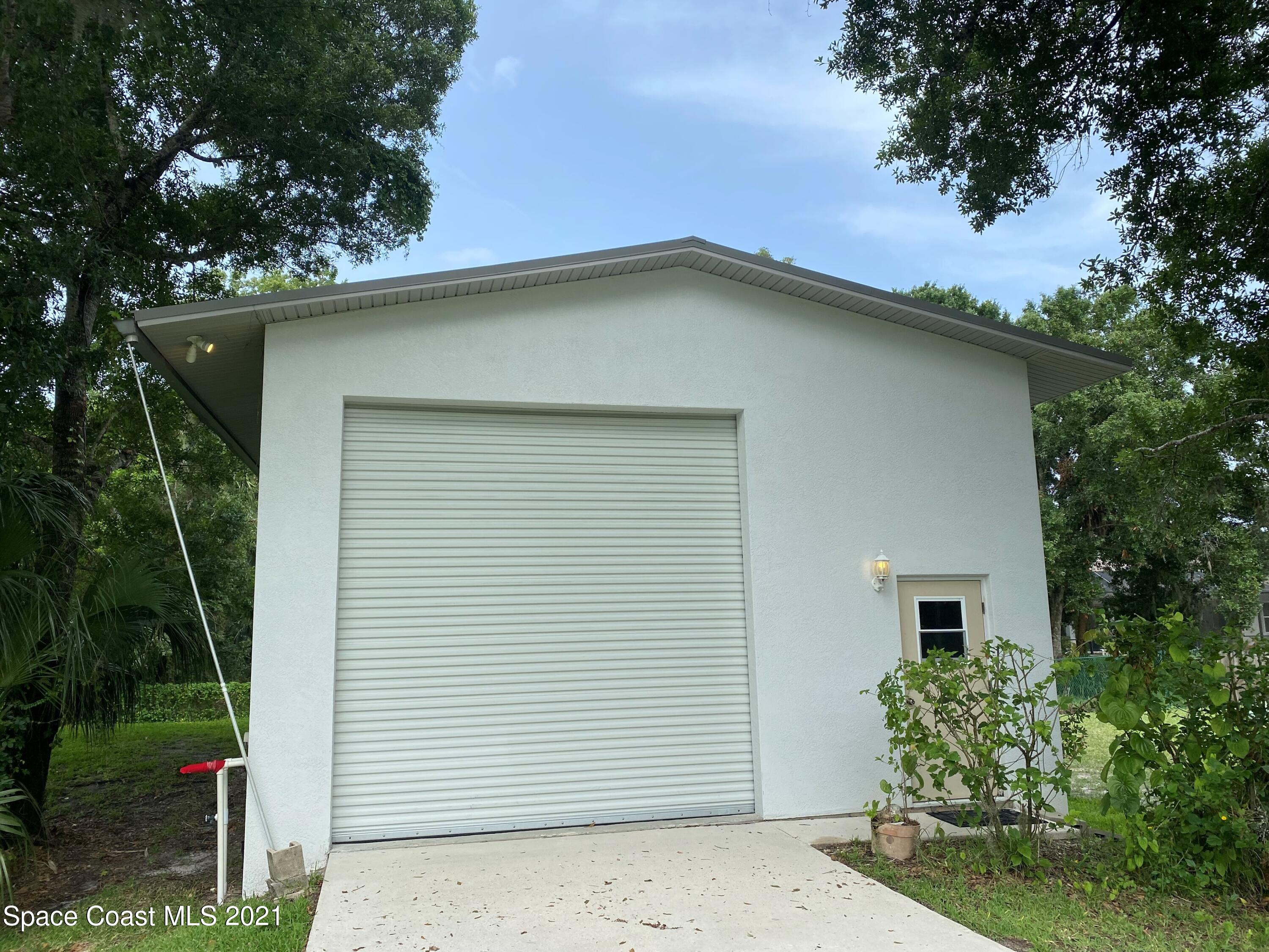 1805 Evers Road Melbourne, FL 32934 - Photo 29 of 29 a house with a tree in the background