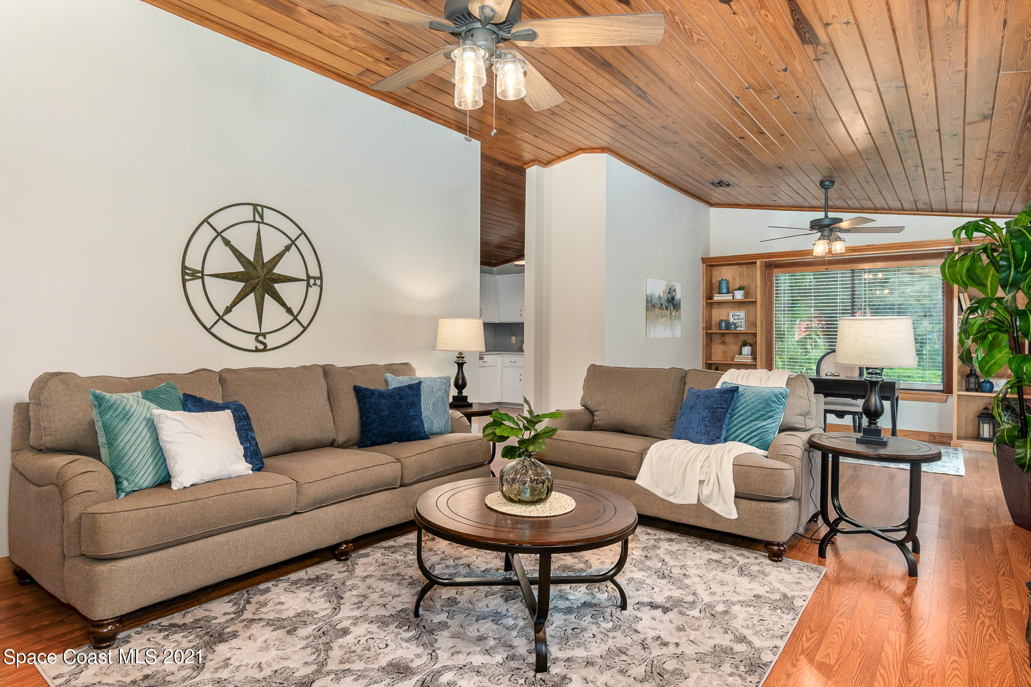 1805 Evers Road Melbourne, FL 32934 - Photo 4 of 29 a living room with furniture a rug potted plant and a large window
