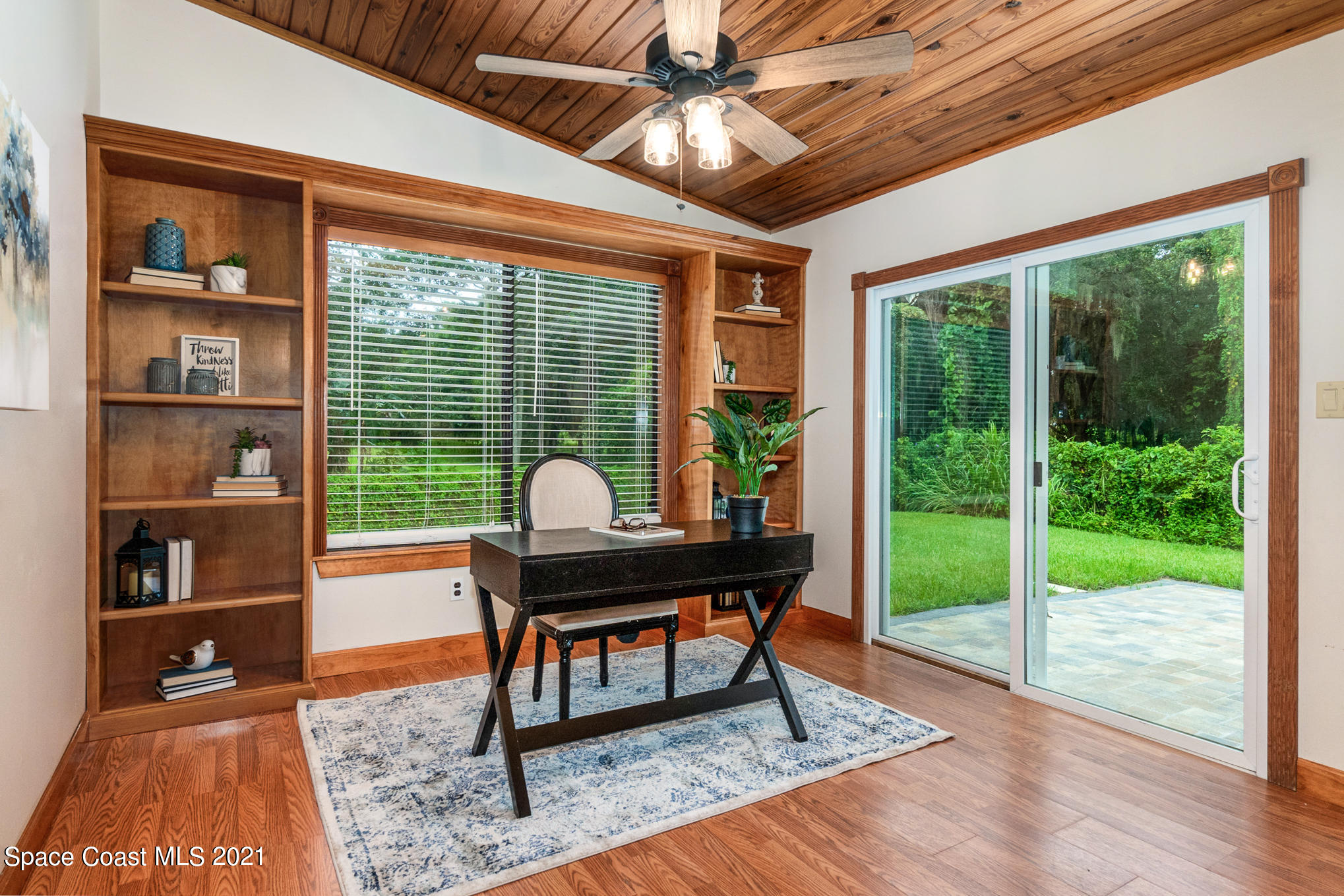 1805 Evers Road Melbourne, FL 32934 - Photo 5 of 29 a work room with furniture and a floor to ceiling window