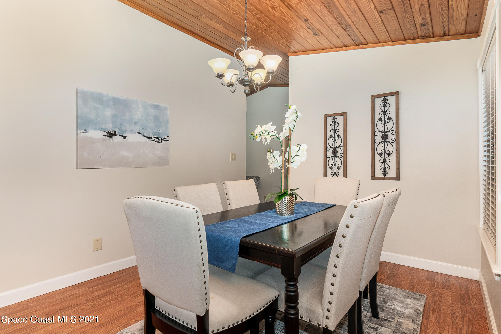 1805 Evers Road Melbourne, FL 32934 - Photo 6 of 29 a view of a dining room with furniture and wooden floor