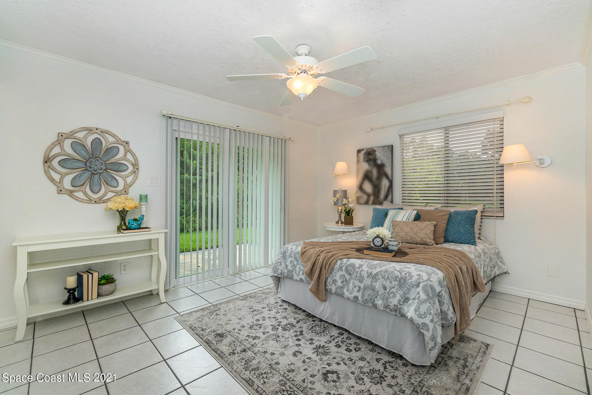 1805 Evers Road Melbourne, FL 32934 - Photo 10 of 29 a bedroom with a bed and a table