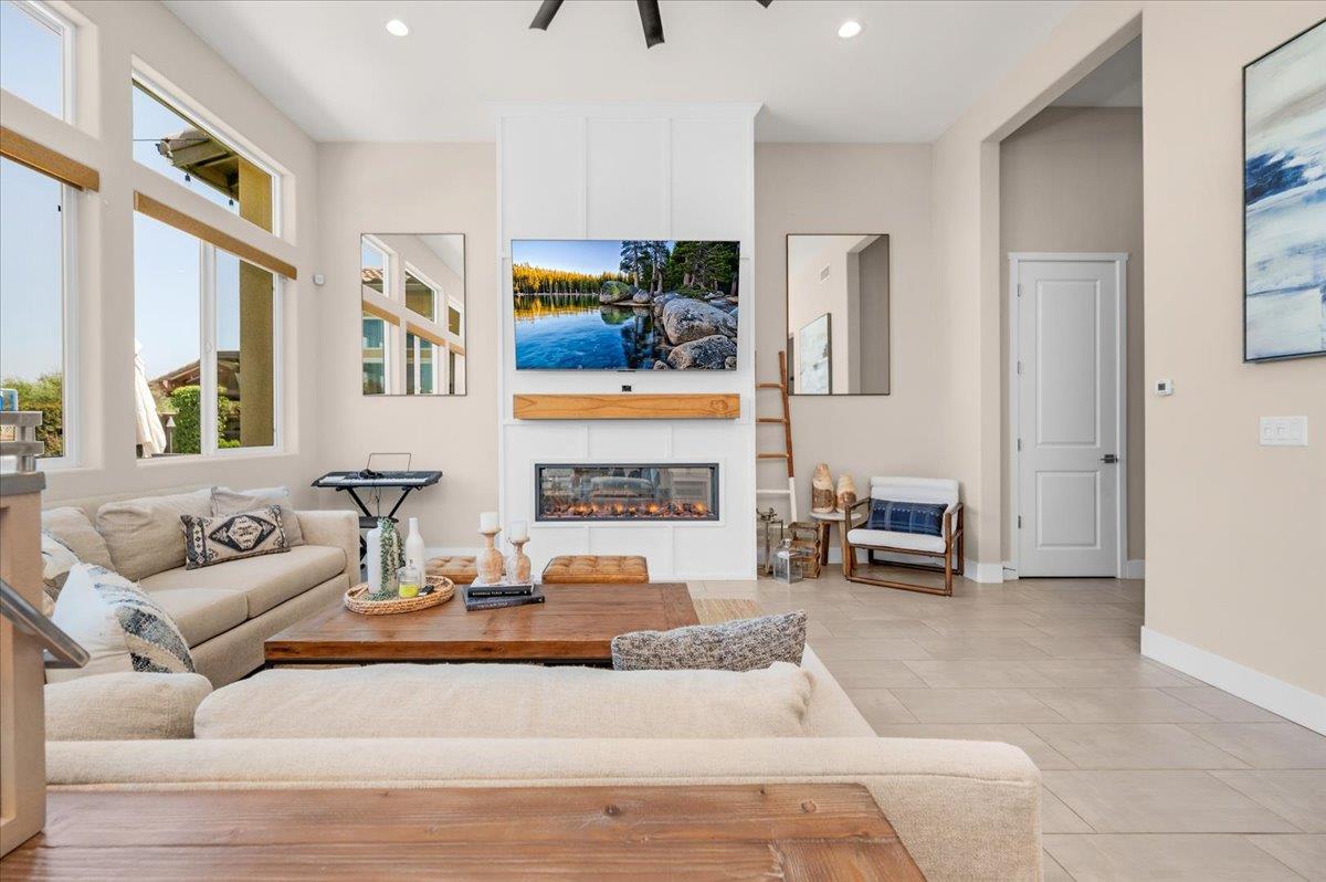 1003 Highland Road Madera, CA 93636 - Photo 16 of 73 a living room with furniture and a fireplace