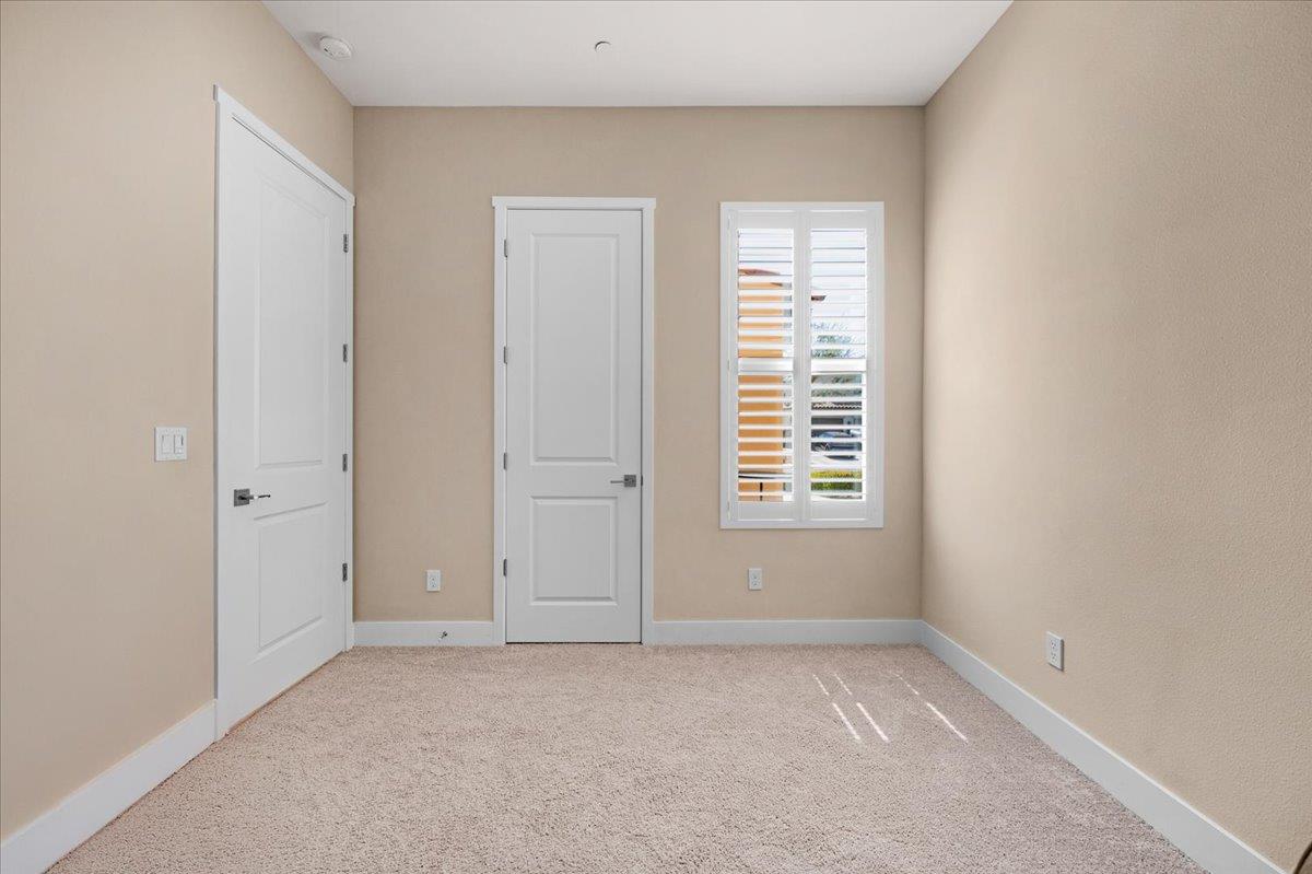 1003 Highland Road Madera, CA 93636 - Photo 31 of 73 a view of an empty room with a window