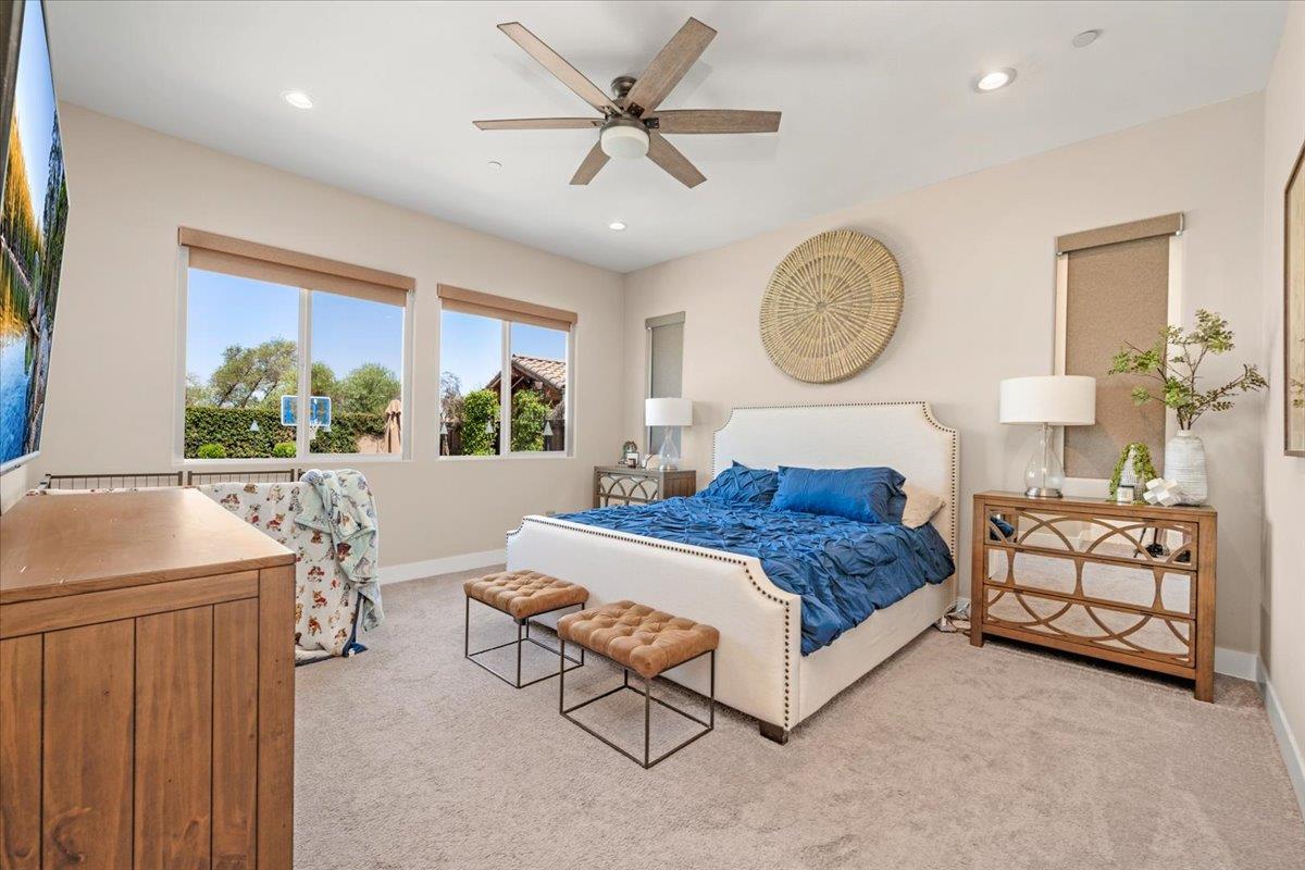 1003 Highland Road Madera, CA 93636 - Photo 34 of 73 a living room with furniture a window and a chandelier
