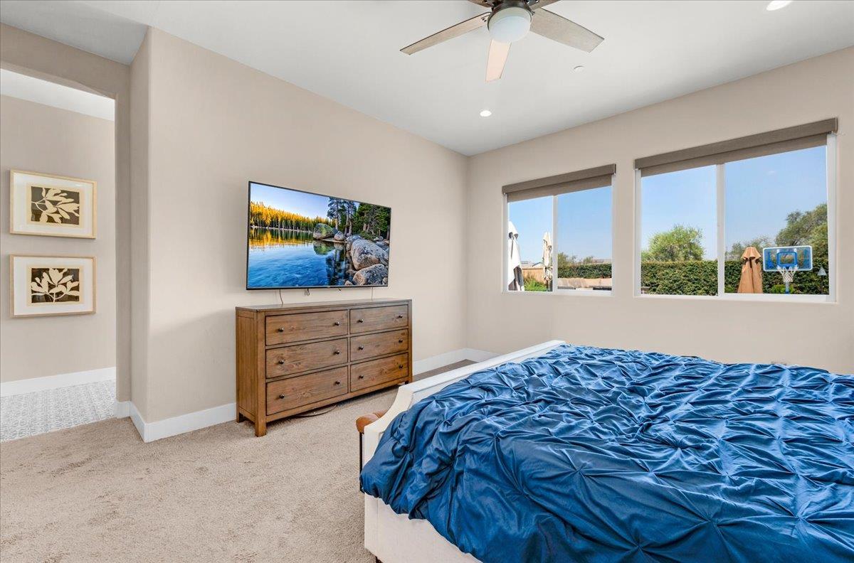 1003 Highland Road Madera, CA 93636 - Photo 35 of 73 a bedroom with a bed and a dresser