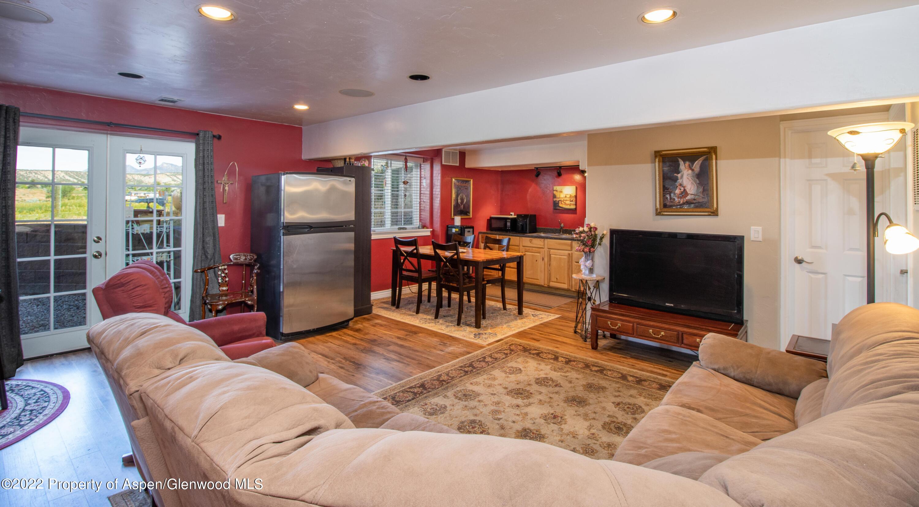 1450 County Road 259 Rifle, CO 81650 - Photo 17 of 28 lower level family room