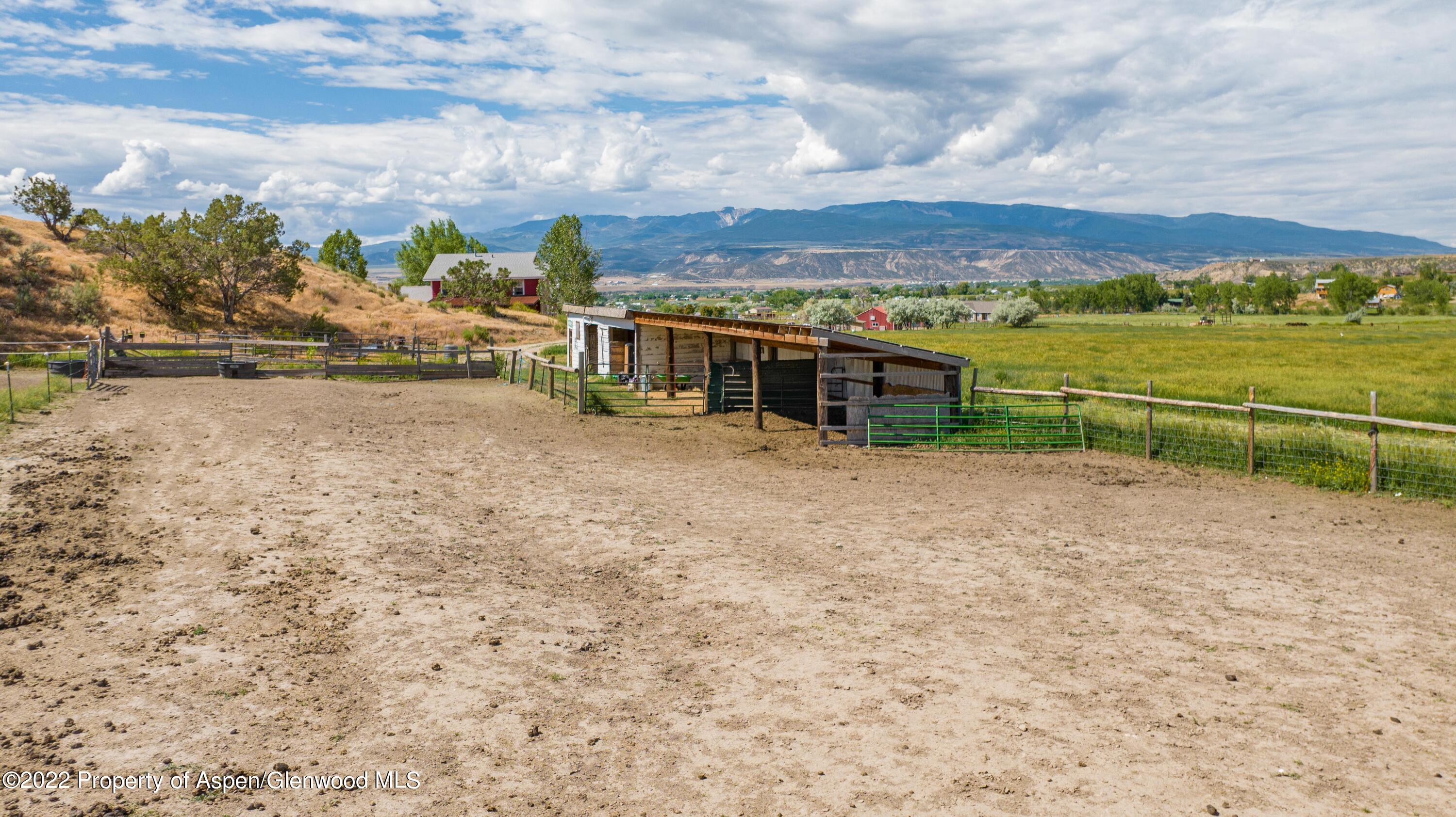 1450 County Road 259 Rifle, CO 81650 - Photo 27 of 28 corral with covered stalls