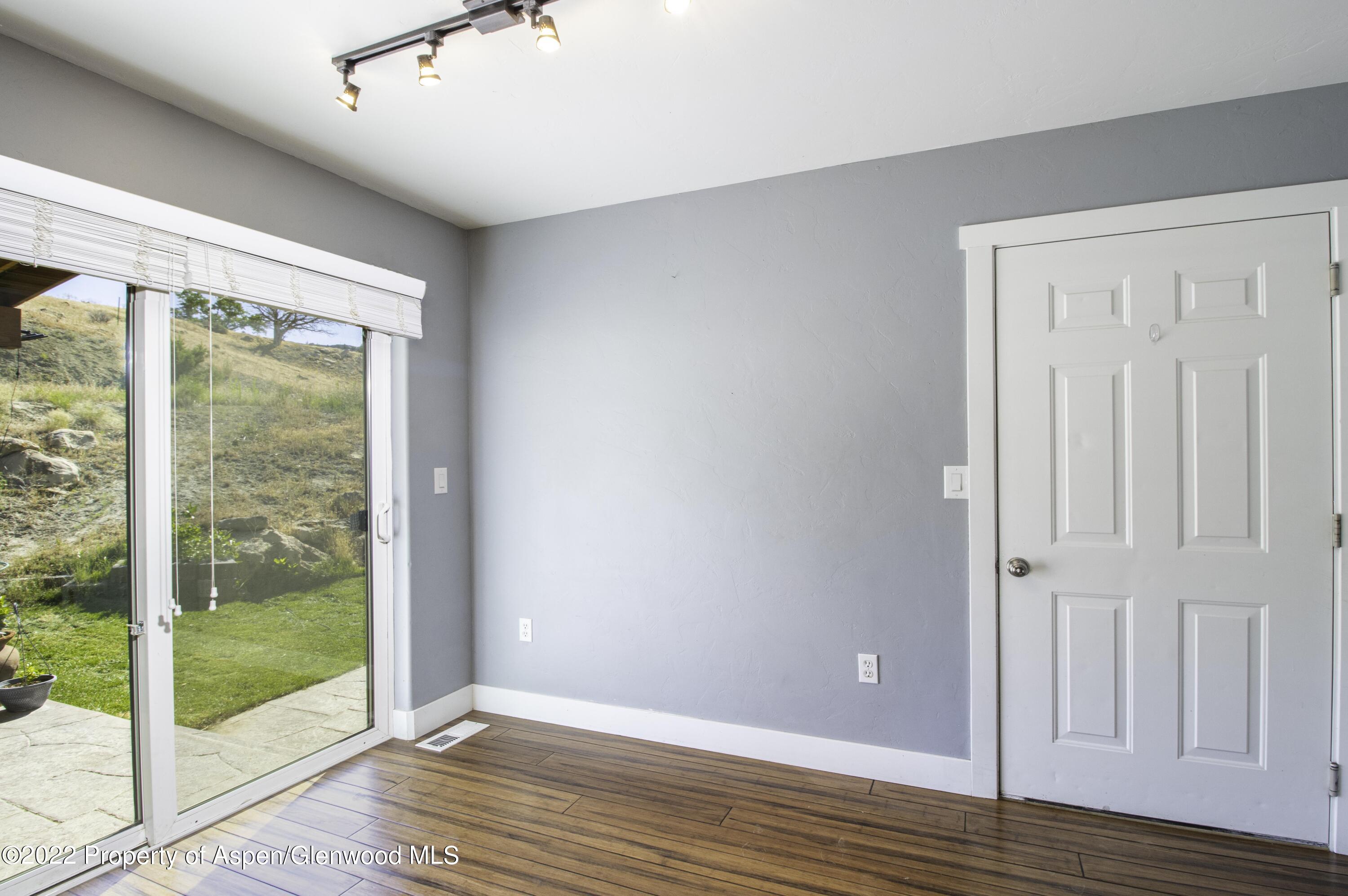 1450 County Road 259 Rifle, CO 81650 - Photo 6 of 28 dining area off kitchen with access to o