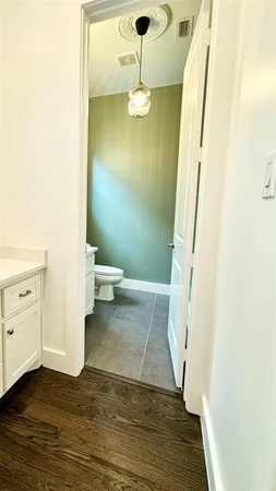 a close view of closet a room and wooden floor