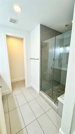 a bathroom with a shower and a toilet