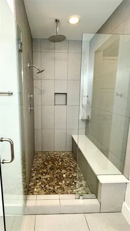 a white toilet sitting next to a sink