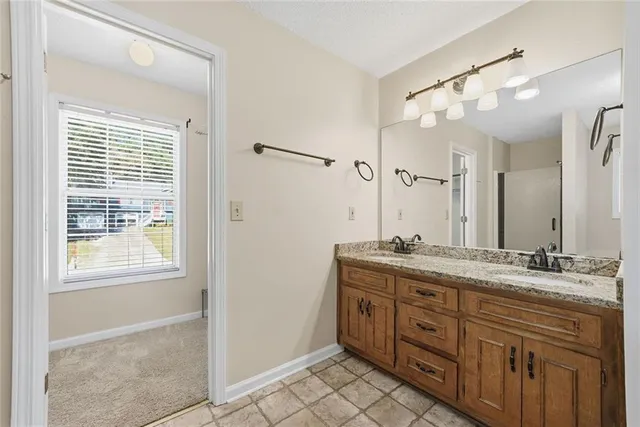 a bathroom with a bathtub and shower