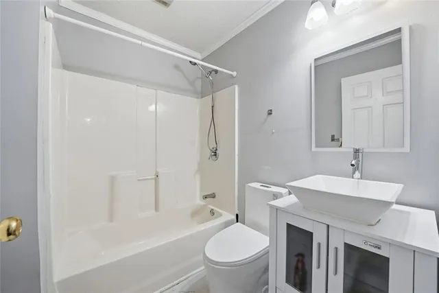 a view of a big room with wooden floor and a window