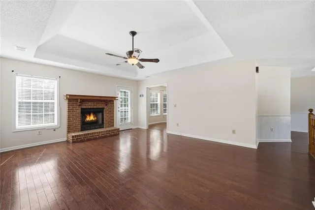 a view of a hallway to room with stair