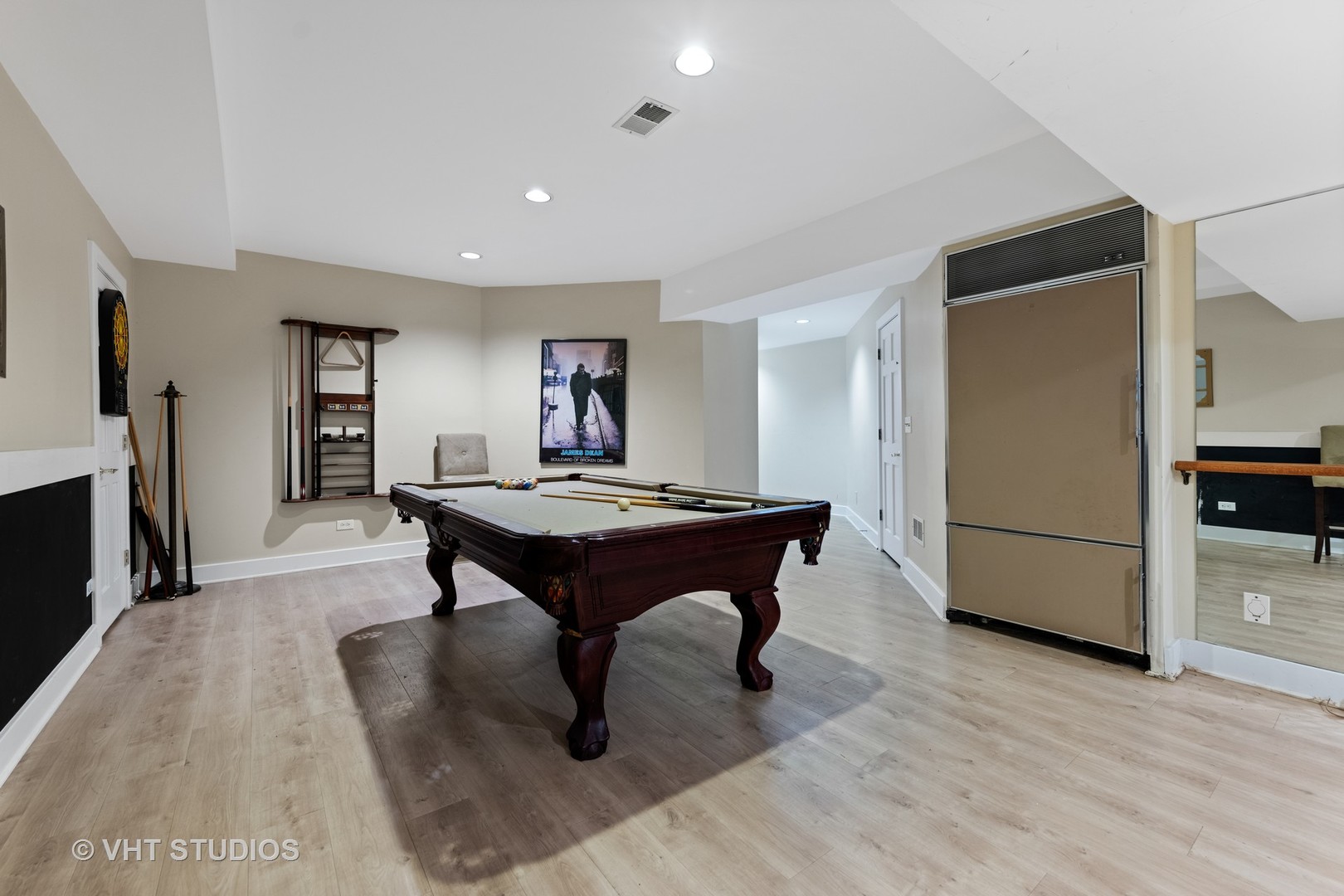 3423 Spring Road Oak Brook, IL 60523 - Photo 37 of 75 a living room with a table and a refrigerator
