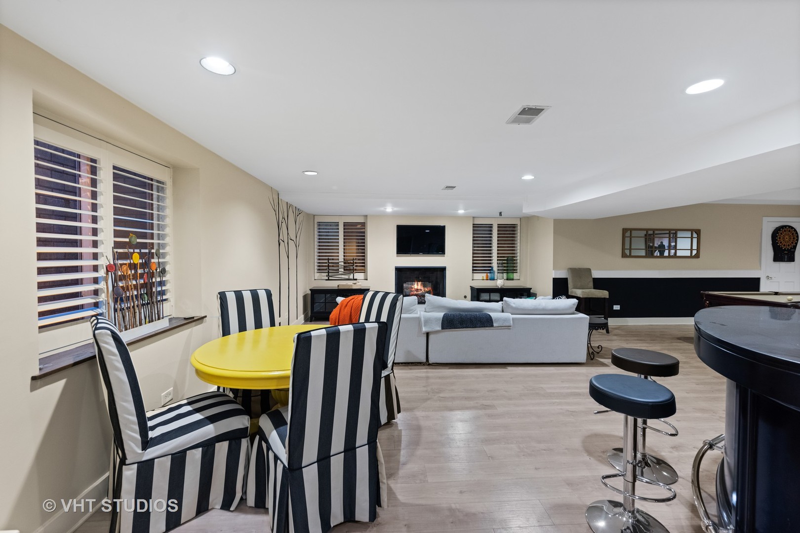 3423 Spring Road Oak Brook, IL 60523 - Photo 38 of 75 a living room with furniture a table and a flat screen tv