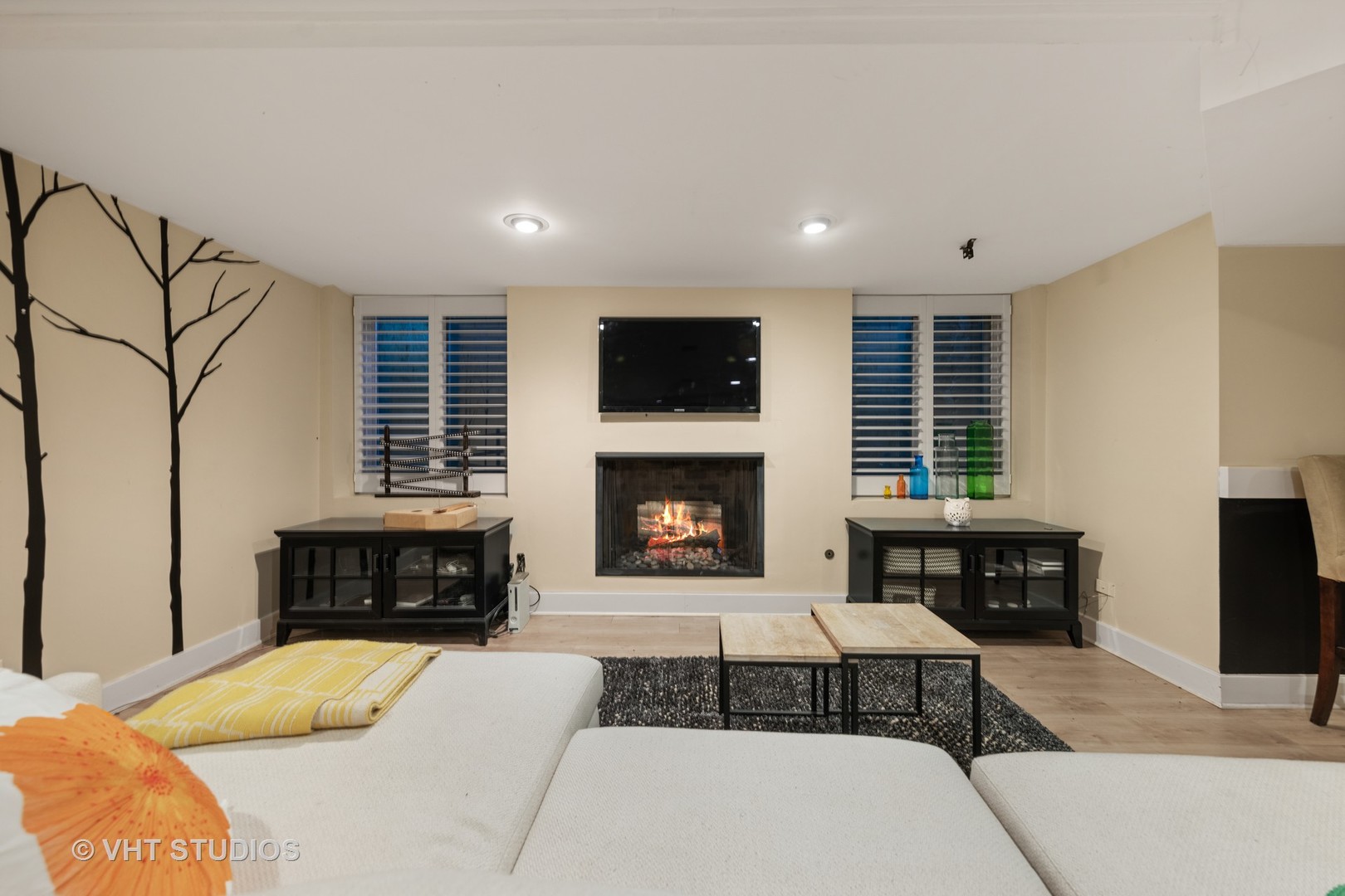 3423 Spring Road Oak Brook, IL 60523 - Photo 39 of 75 a living room with furniture a fireplace and a flat screen tv