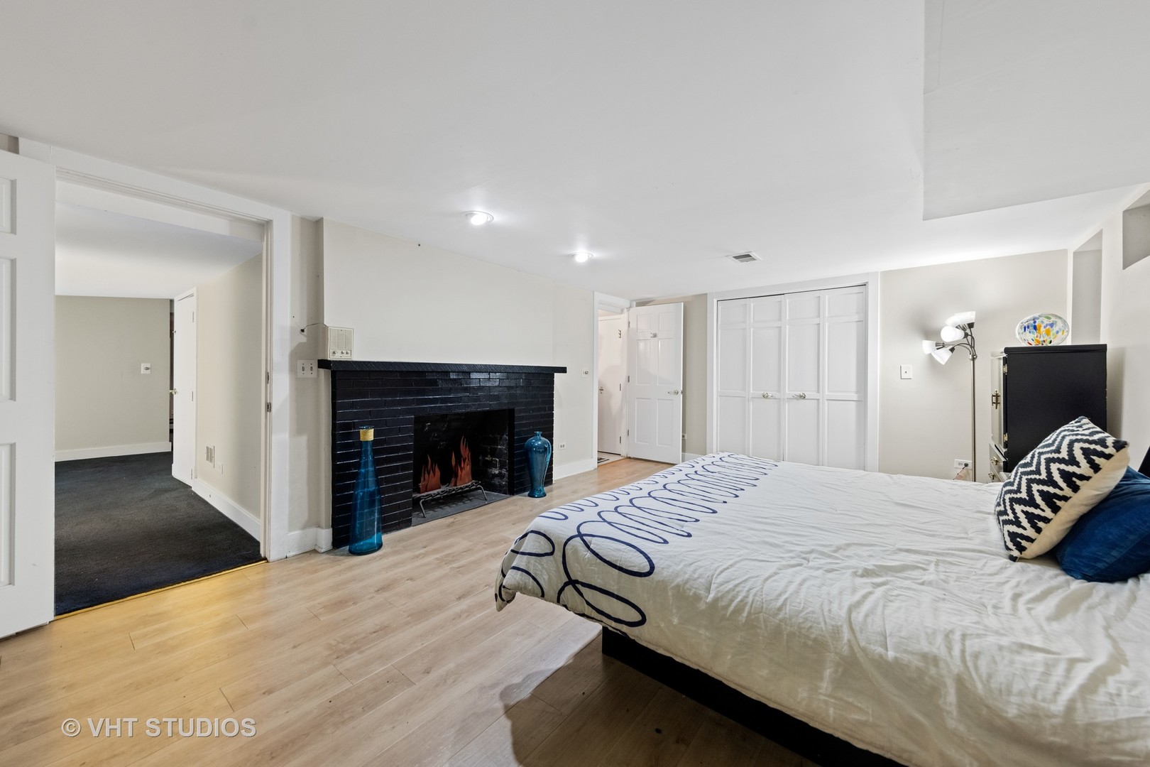 3423 Spring Road Oak Brook, IL 60523 - Photo 41 of 75 a bedroom with a bed and a fireplace
